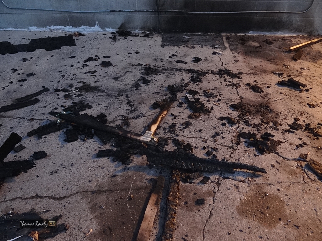 Fire behind Gun & Reel    CSi Photo